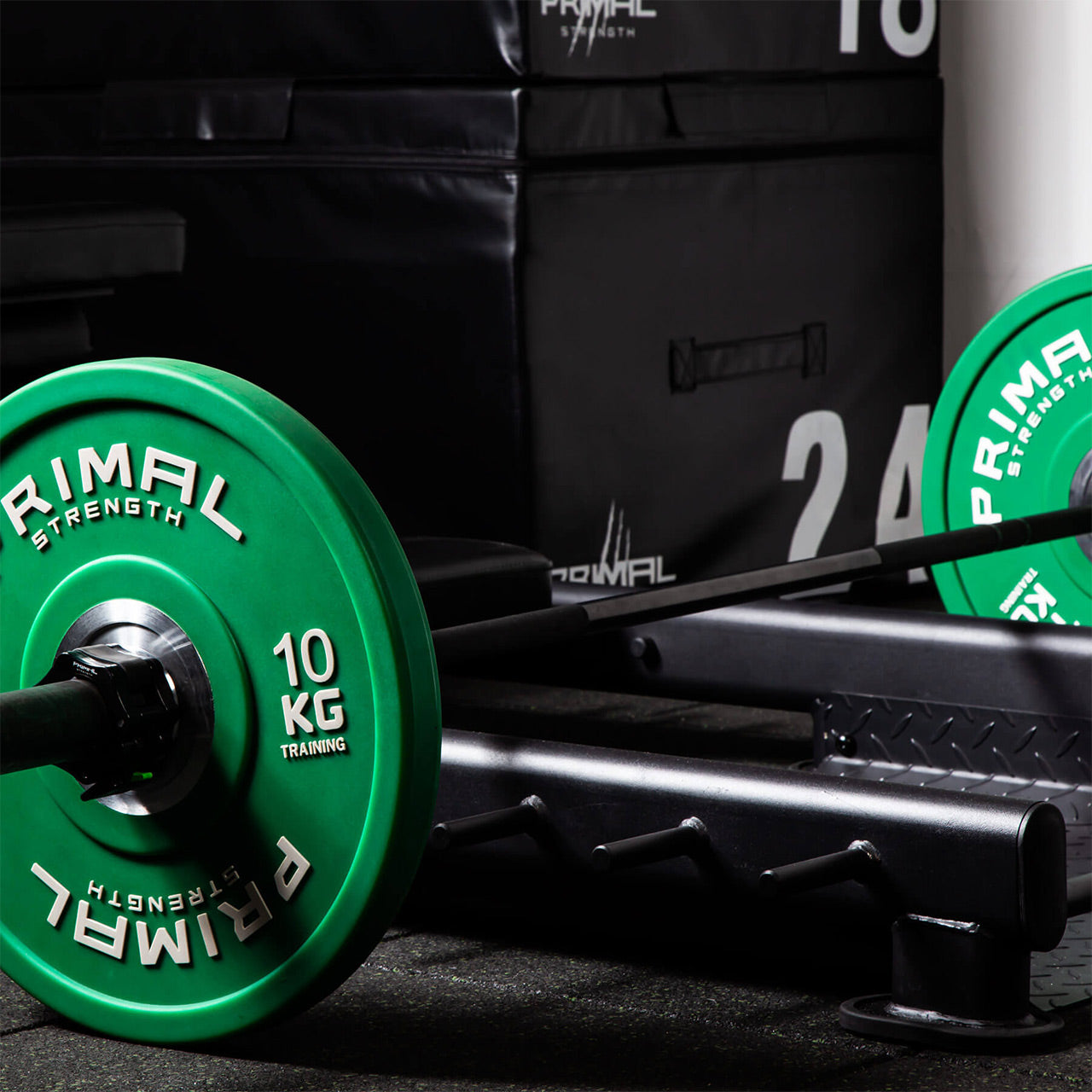 Close up view of barbell and bumpers